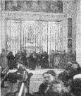 Photograph of the faithful surrounding the vault of where St. Therese remains laid at the Carmelite Chapel